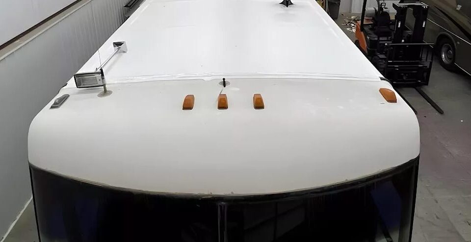 Front cap of a motorhome roof coated in seamless white polyurea