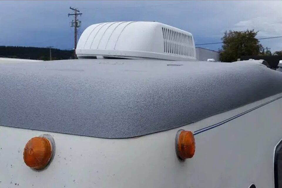 RV roof cap finished in textured gray ArmorThane polyurea